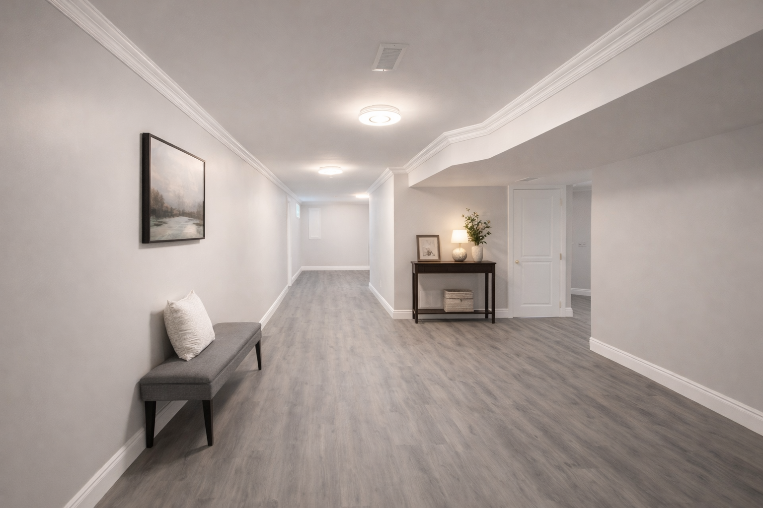 Bright finished basement with modern flooring and clean layout in West Island Montreal