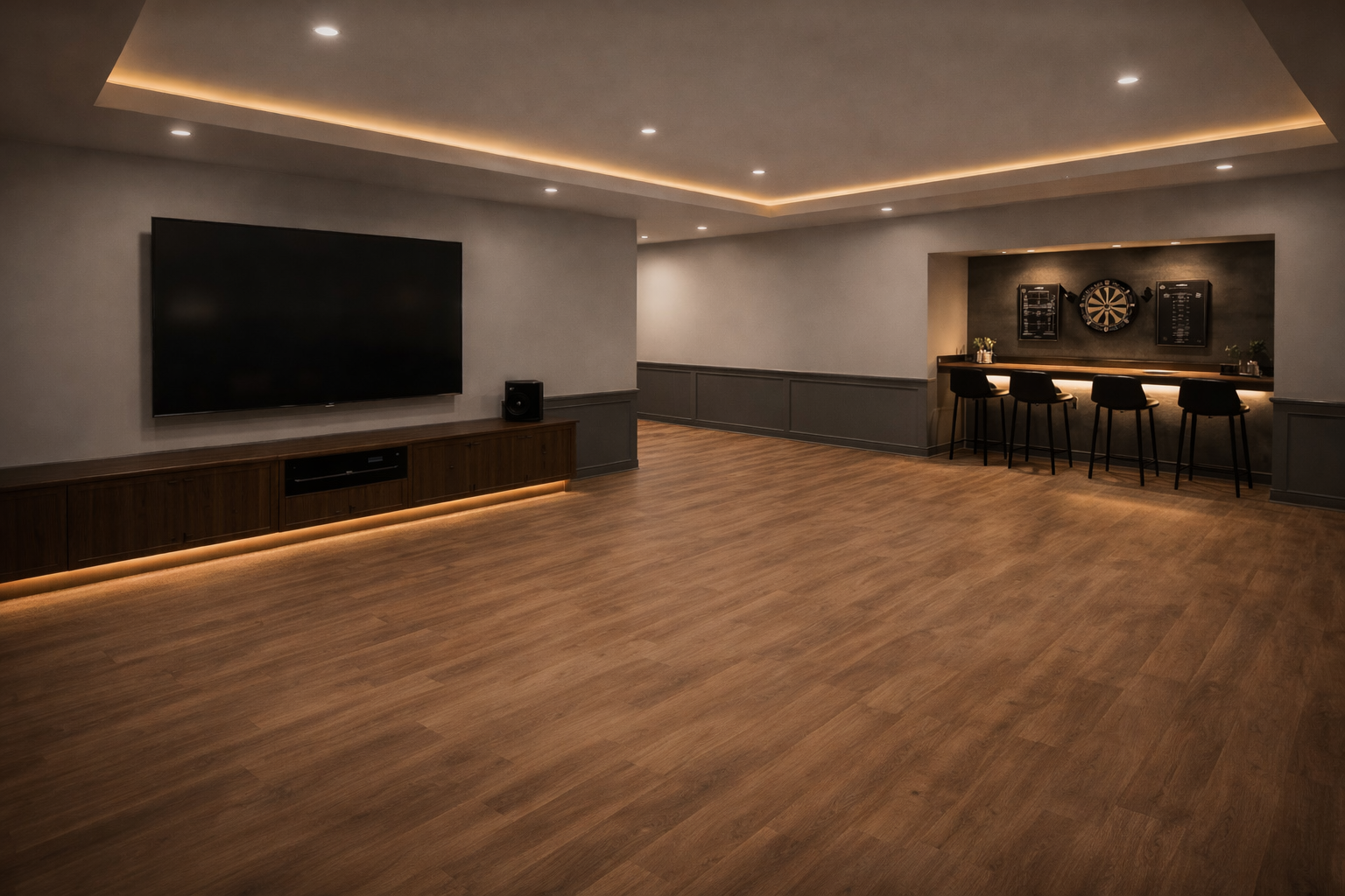Modern basement renovation with built-in bar, LED lighting and large TV wall in West Island Montreal