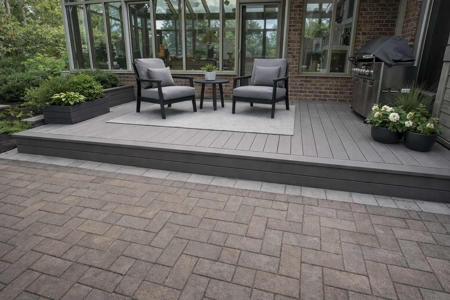 Composite deck construction in West Island Montreal with backyard patio, outdoor seating and modern landscaping