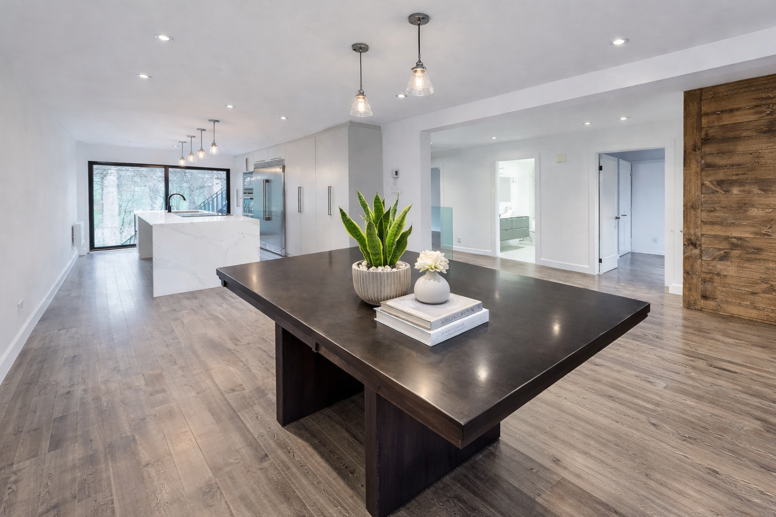 Full home renovation in West Island Montreal featuring modern interior finishes, open-concept layout, custom kitchen with Carrara quartz island and wood flooring, serving Dorval, Pointe-Claire, Pierrefonds, Kirkland, Beaconsfield, Dollard-Des-Ormeaux and Vaudreuil-Dorion