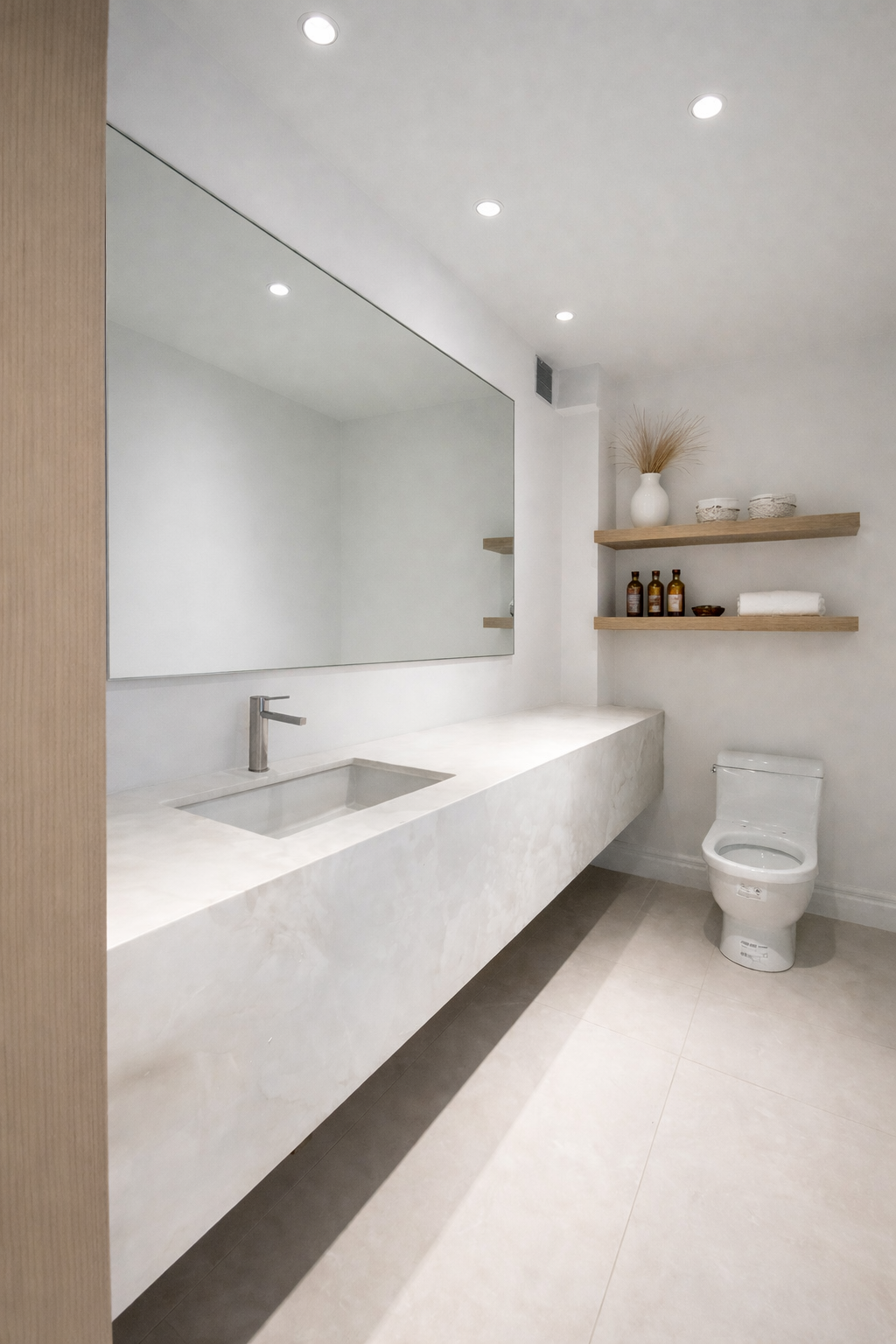 Minimalist bathroom with floating counter and wood shelves in West Island Montreal
