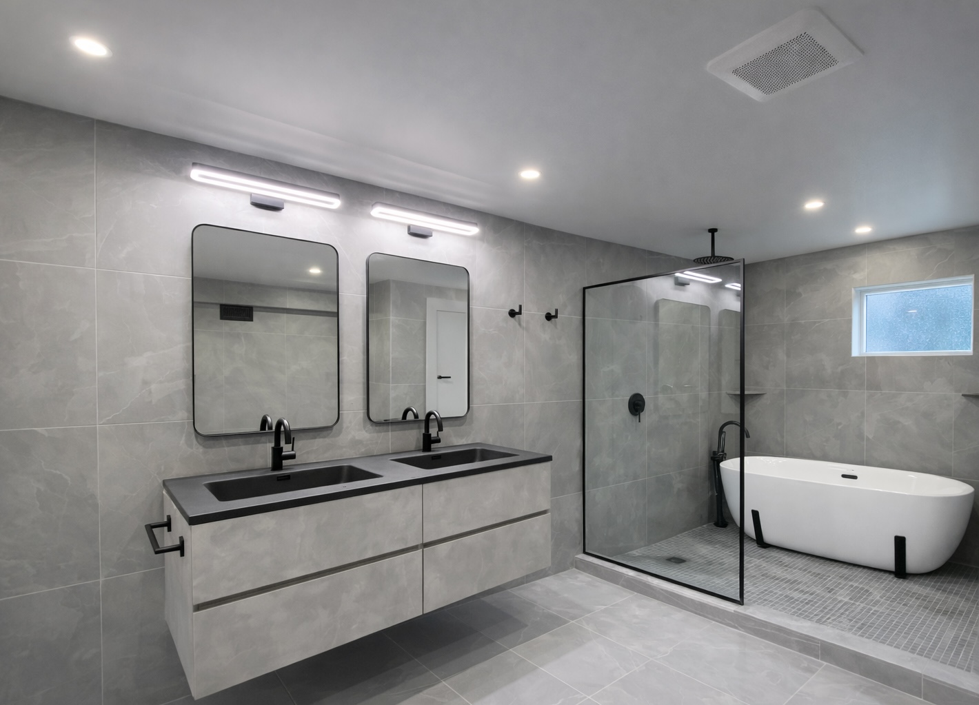 Modern bathroom with double vanity, glass walk-in shower and freestanding bathtub in West Island Montreal