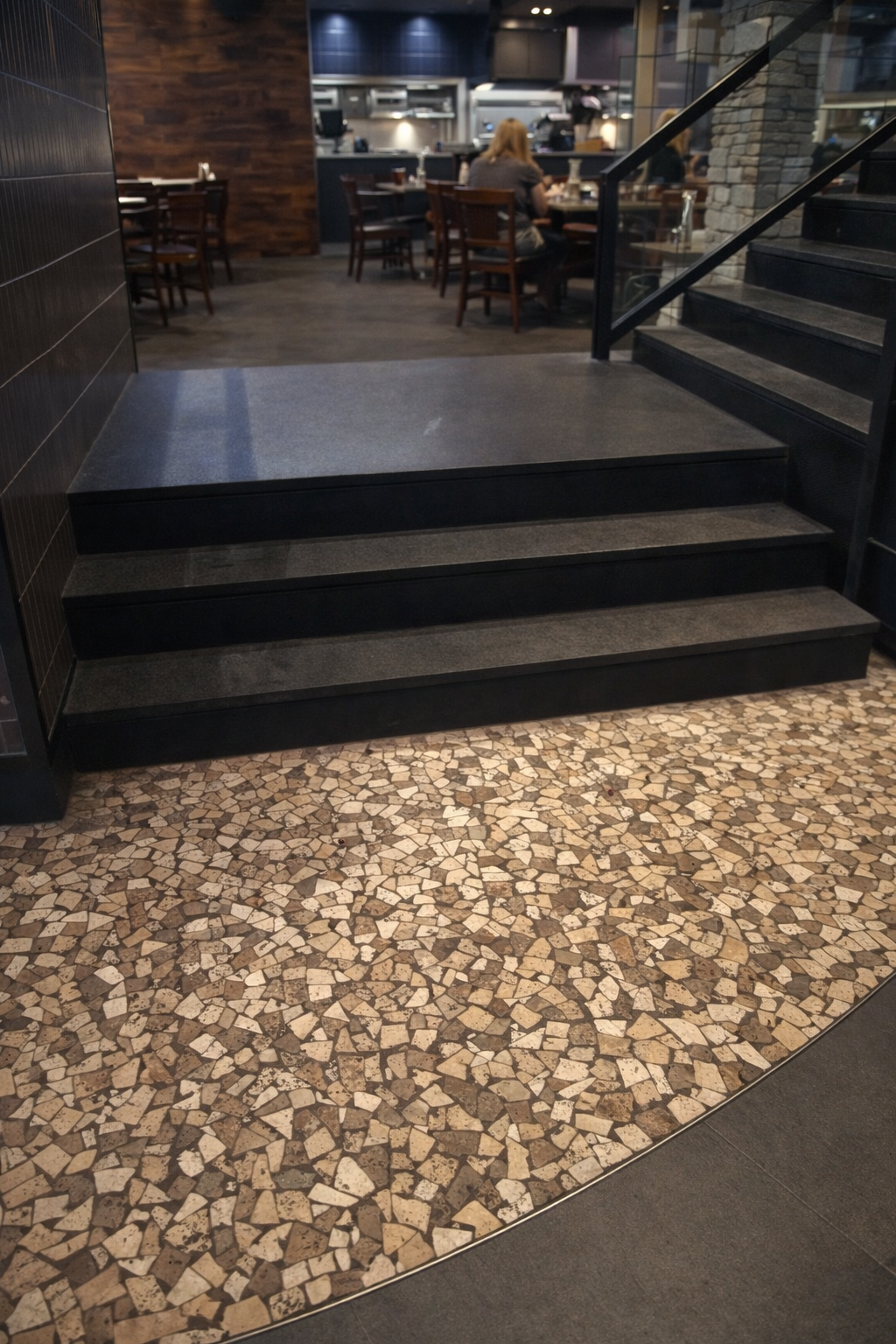 Restaurant renovation in West Island Montreal featuring custom stairs, terrazzo flooring, tile finishes and modern commercial interior design